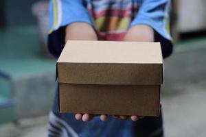 empty brown cardboard photo held in hand