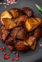 Delicious potatoes baked in their skins with rosemary and spices photo