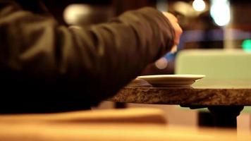 Young man drinking coffee in cafe video