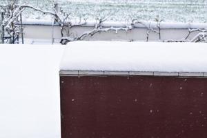 Falling Snow on a Roof photo