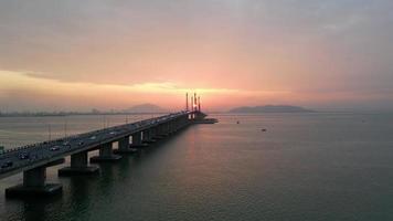 Aerial move near Penang Bridge highway in sun rise morning video