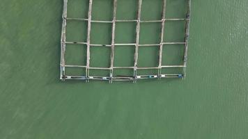Aerial look down kelong fish farm at sea video