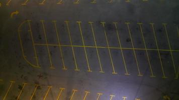Aerial descending view empty car park in night video