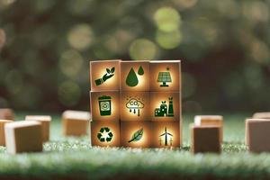 Companies are targeting net zero greenhouse gas emissions. Carbon credit concept.Tradable certificate to drive industry in direction of low emissions in efficiency cost.Wooden cubes with decrease CO2 photo