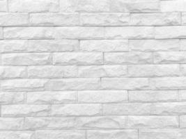 Seamless texture of white stone wall a rough surface, with space for text, for a background. photo