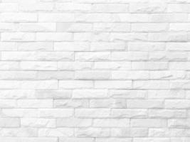 Seamless texture of white stone wall a rough surface, with space for text, for a background. photo