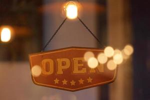 Open sign in the window of a shop photo