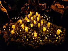 Dozens of candles lit for the Dia de los Muertos photo