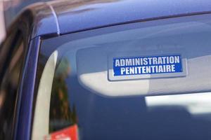 Administration Penitentiaire - Car sun visor sign photo