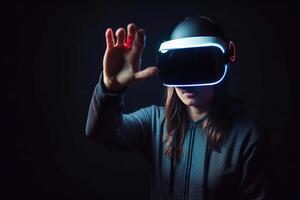 a woman wearing a virtual reality headset touching the virtual object on dark background. photo