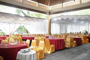 Wedding dinner table reception. A very long wedding table going into perspective. photo