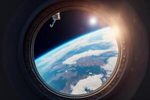 View from a porthole of space station on the Earth. photo