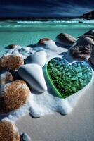 heart shaped glass sitting on top of a sandy beach. . photo