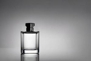 Transparent bottle perfume mockup studio shot, isolated background, white label, marketing and product presentation. photo