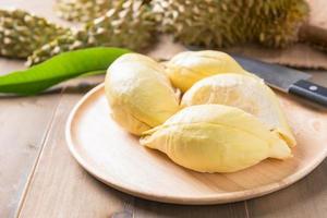 fresh durian on wood dish, king of fruit photo