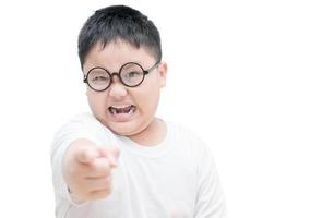 Serious or angry obses  kid points index finger isolated photo