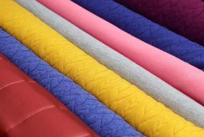 Samples of cloth and fabrics in different colors found at a fabrics market in Germany photo