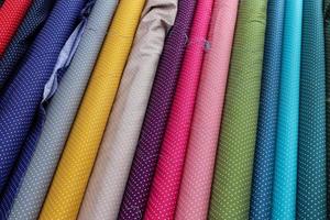 Samples of cloth and fabrics in different colors found at a fabrics market in Germany photo