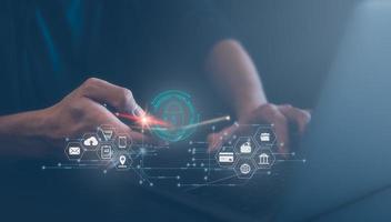 Cyber security network concept. Padlock icon and internet technology networking. Businessman protecting personal information on tablet and virtual interface. Data protection privacy financial data. photo