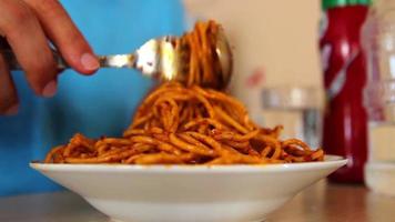 Making tomato paste pasta at home, prepare and eat with sauce, selective focus video