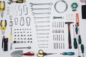 Set of tools for repair in a case on a white background. Assorted work or construction tools. Wrenches, Pliers, screwdriver. Top view photo