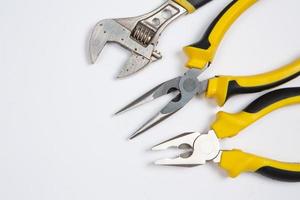 Set of tools for repair in a case on a white background. Assorted work or construction tools. Wrenches, Pliers, screwdriver. Top view photo