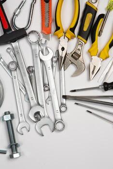 Set of tools for repair in a case on a white background. Assorted work or construction tools. Wrenches, Pliers, screwdriver. Top view photo