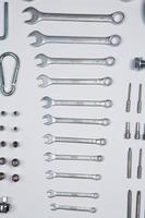 Set of tools for repair in a case on a white background. Assorted work or construction tools. Wrenches, Pliers, screwdriver. Top view photo