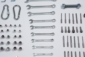 Set of tools for repair in a case on a white background. Assorted work or construction tools. Wrenches, Pliers, screwdriver. Top view photo