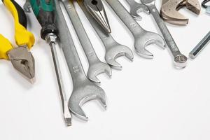 Set of tools for repair in a case on a white background. Assorted work or construction tools. Wrenches, Pliers, screwdriver. Top view photo