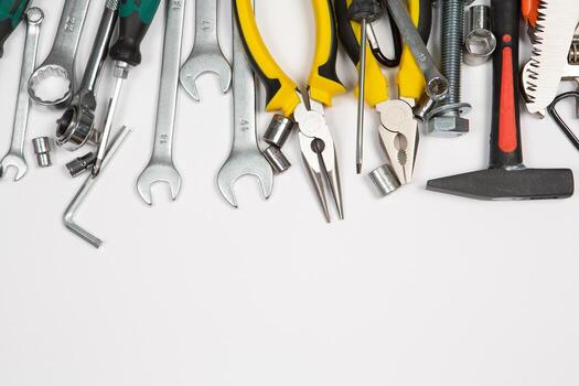 Set of tools for repair in a case on a white background. Assorted work or construction tools. Wrenches, Pliers, screwdriver. Top view photo