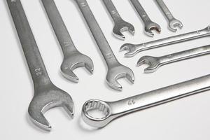 Set of tools for repair in a case on a white background. Assorted work or construction tools. Wrenches, Pliers, screwdriver. Top view photo