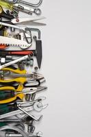 Set of tools for repair in a case on a white background. Assorted work or construction tools. Wrenches, Pliers, screwdriver. Top view photo