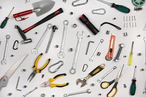 Set of tools for repair in a case on a white background. Assorted work or construction tools. Wrenches, Pliers, screwdriver. Top view photo