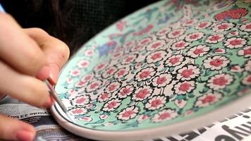Painting hand made ottoman tile motifs video