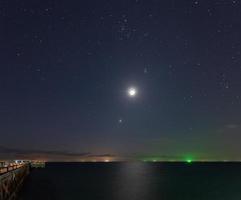 Night shot from Natai beach in Thailand with long exposure photo