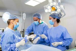 Doctor and assistant nurse operating for help patient from dangerous emergency case .Surgical instruments on the sterile table in the emergency operation room in the hospital.Health care and Medical photo