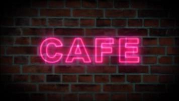 kaffe neon brev på tegelstenar vägg bakgrund. video