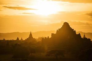 The sunset of Bagan, Myanmar is an ancient city with thousands of historic buddhist temples and stupas. photo