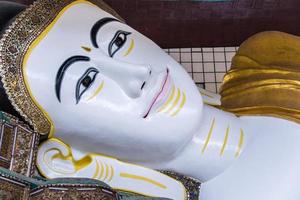 Close up Face of Shwethalyaung Reclining Buddha at Bago, Myanmar photo