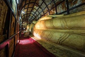 Grand reclining Buddha in temple, Bagan, Myanmar photo