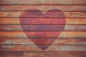 Heart shape on wooden Wall photo