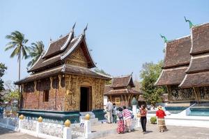 LUANG PRABANG , LAOS -FEB 26 2023 Wat Xieng Thong is one of the largest temples in Luang Prabang. A symbol of great historic importance, its structure has characteristics of 16th-century photo