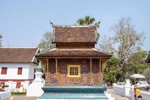 LUANG PRABANG , LAOS -FEB 26 2023 Wat Xieng Thong is one of the largest temples in Luang Prabang. A symbol of great historic importance, its structure has characteristics of 16th-century photo