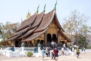 LUANG PRABANG , LAOS -FEB 26 2023 Wat Xieng Thong is one of the largest temples in Luang Prabang. A symbol of great historic importance, its structure has characteristics of 16th-century photo