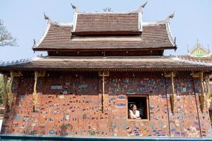 LUANG PRABANG , LAOS -FEB 26 2023 Wat Xieng Thong is one of the largest temples in Luang Prabang. A symbol of great historic importance, its structure has characteristics of 16th-century photo