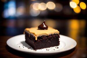 Piece of cake on a white plate on a wooden table. Homemade cake with nuts and honey. photo