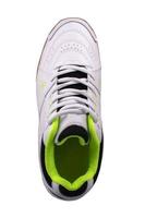 White sneaker with black inserts on a white background. photo