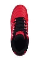 Red sneakers with black laces and white stripes on a white background. photo