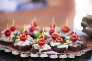 Sandwiches with bread and lard, garnished with cherry photo